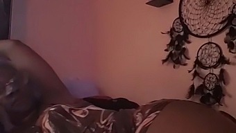 A Woman Pleasuring Herself In Bed